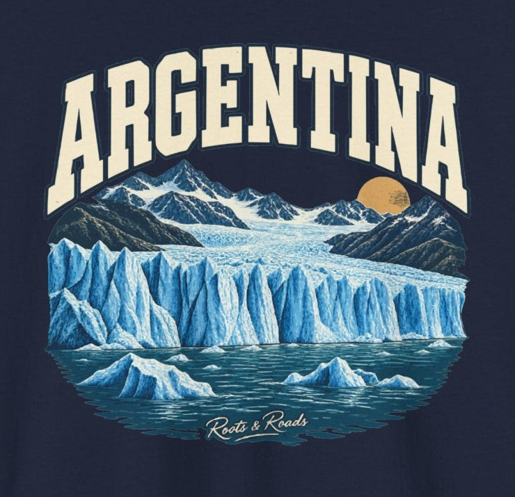 Print detail on Navy fabric showing ARGENTINA lettering, blue glacier, snowy peaks, floating ice, warm sun and Roots & Roads signature.