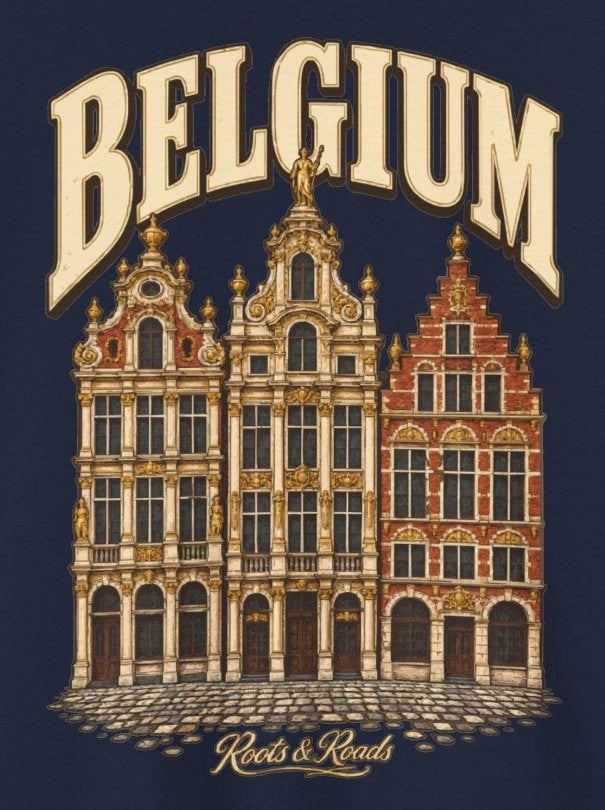 Print detail on Navy cotton showing cream BELGIUM lettering, ornate Brussels-inspired guild-house façades and a cobblestone base, with Roots & Roads script.