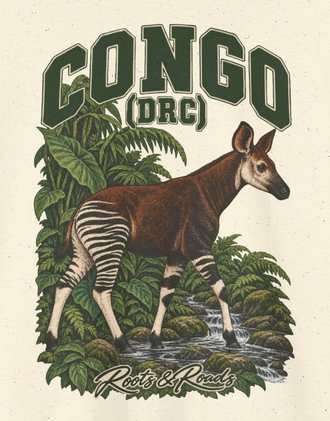 Print detail cropped from the Natural Congo (DRC) supplier T-shirt mockup, showing green CONGO (DRC) lettering above an okapi in a rainforest stream framed by broad leaves and Roots & Roads script.
