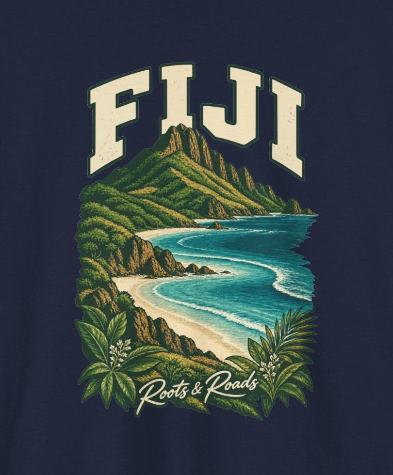 Print detail cropped from the Navy Fiji supplier T-shirt mockup, showing cream FIJI lettering, a green island ridge, pale beaches, turquoise waves and shoreline plants and Roots & Roads script.