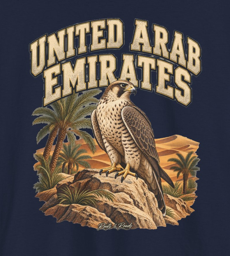 Print detail of UNITED ARAB EMIRATES lettering, a perched falcon, palms, desert dunes and Roots & Roads script on navy.