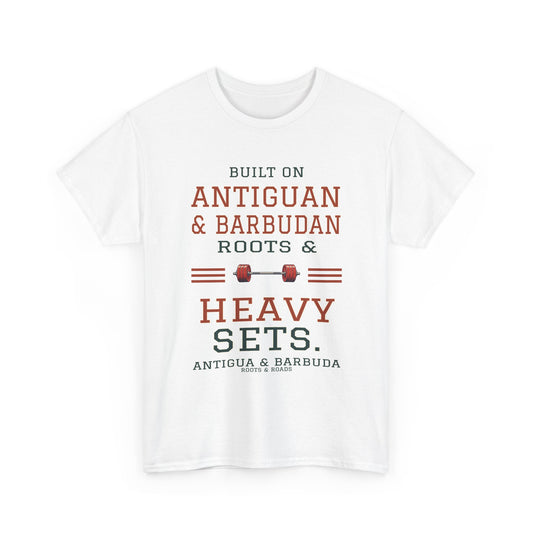 White Antigua & Barbuda gym T-shirt, front view with vintage artwork reading “Built on Antiguan & Barbudan roots & heavy sets.” and Roots & Roads signature.