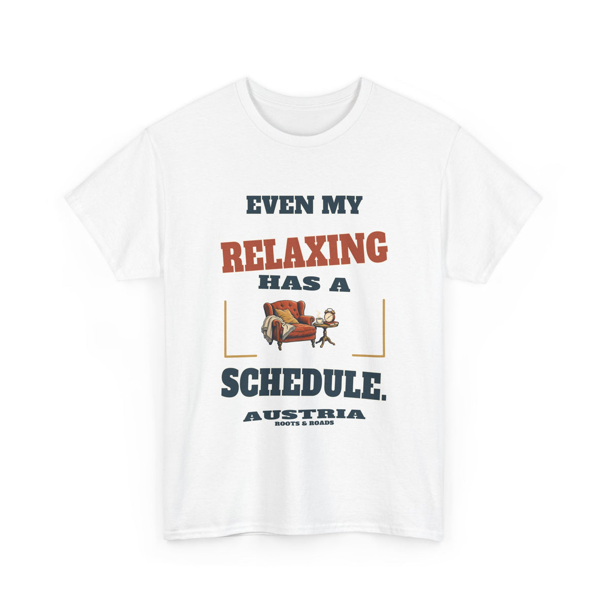 Austria Scheduled Relaxing T-Shirt in White, with the full quote “Even my relaxing has a schedule.”, Austria label, and Roots & Roads signature on the front.