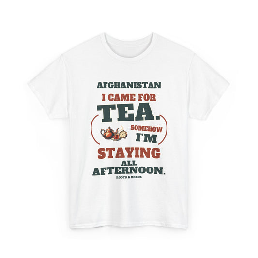 White Afghanistan T-shirt, front view, with vintage café lettering reading “I came for tea. Somehow I’m staying all afternoon.” and a teapot, tea glass and clock illustration.