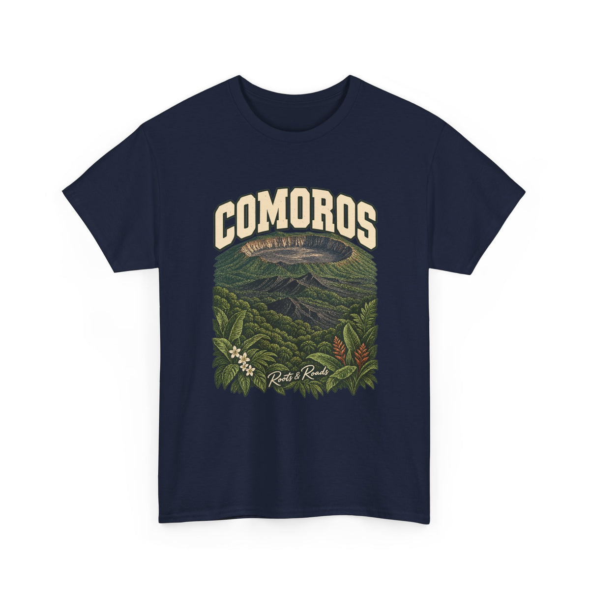 Front view of a Navy Gildan 5000 T-shirt with cream COMOROS lettering above a volcanic caldera, green forest and flowering foliage, finished with Roots & Roads script.