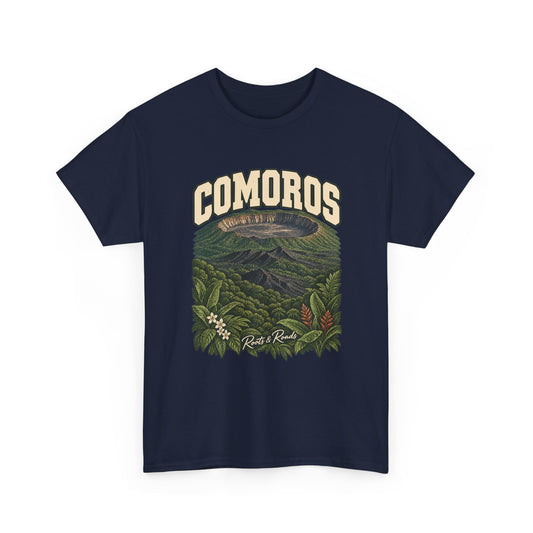 Front view of a Navy Gildan 5000 T-shirt with cream COMOROS lettering above a volcanic caldera, green forest and flowering foliage, finished with Roots & Roads script.