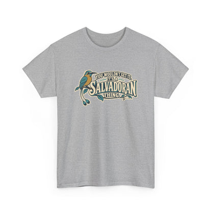 Alternate front view of the Sport Grey Salvadoran Thing T-shirt with “You wouldn’t get it. It’s a Salvadoran thing.” oversized cream sign-painted lettering with teal shadows, a torogoz and integrated foliage.