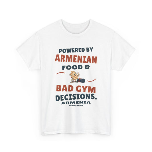 Armenia Bad Gym Decisions T-Shirt in White, with the full quote “Powered by Armenian food & bad gym decisions.”, Armenia label, and Roots & Roads signature on the front.