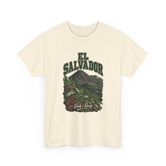 Front view of a Natural Gildan 5000 T-shirt with green two-line EL SALVADOR lettering above a forested volcanic cone, broad leaves and warm lava rocks, finished with Roots & Roads script.