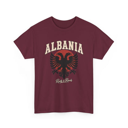 Front view of the Roots & Roads Albania Fresh Prints Gildan 5000 T-shirt in Maroon, with cream arched lettering, a black double-headed eagle and muted red circular accent.