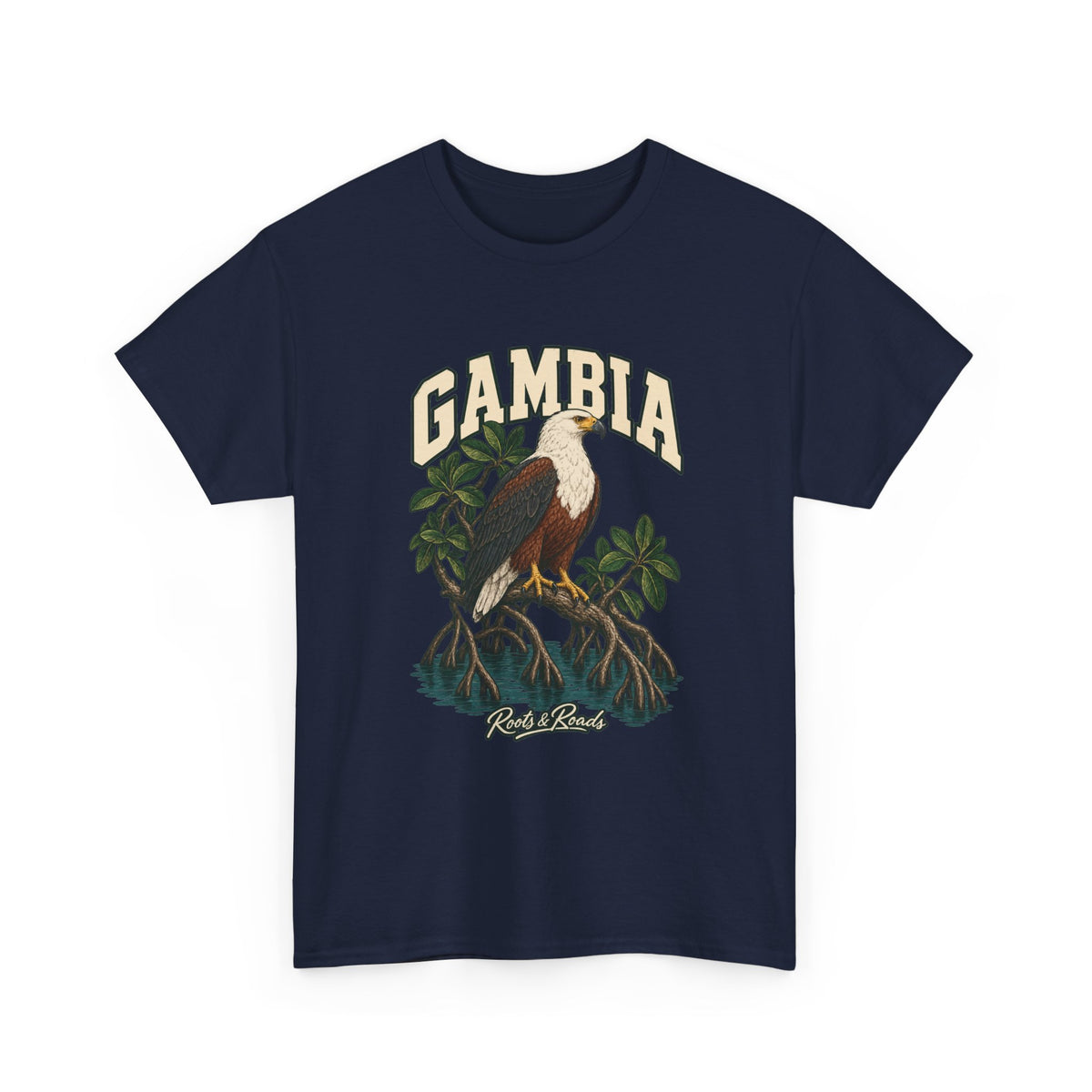 Front view of a Navy Gildan 5000 T-shirt with cream GAMBIA lettering above a white-headed fish eagle, mangrove roots and still water, finished with Roots & Roads script.