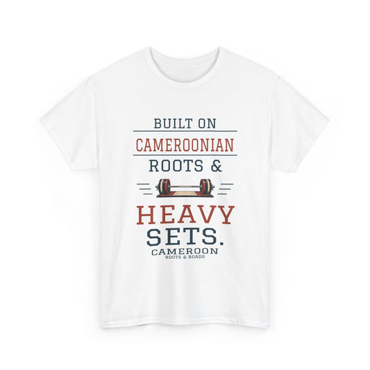 Cameroon Heavy Sets Gym T-Shirt in White, front barbell illustration with the quote “Built on Cameroonian roots & heavy sets.”