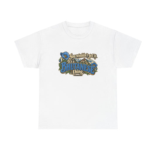 White Bhutan Bhutanese Thing T-shirt, flat front view with blue vintage lettering, cream script, blue poppies and a Himalayan monastery; “You wouldn’t get it. It’s a Bhutanese thing.”