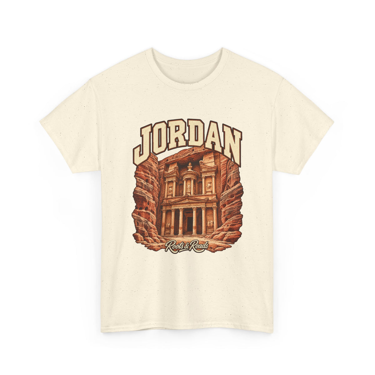 Front view of a Natural Gildan 5000 T-shirt with cream JORDAN lettering, a rock-cut stone facade and warm sandstone walls, and Roots & Roads script.