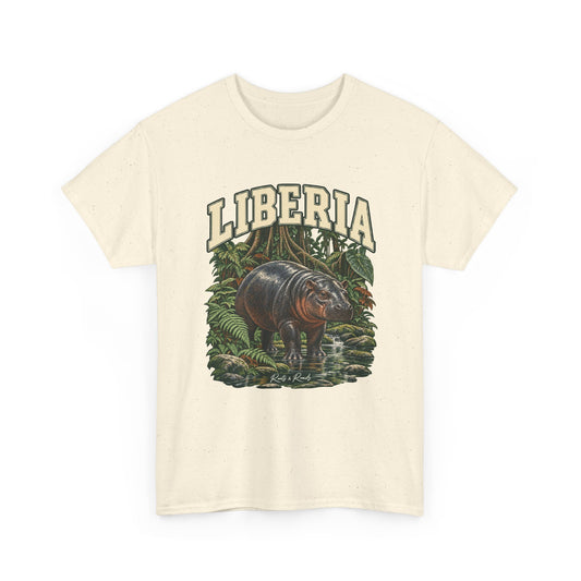 Front view of a Natural Gildan 5000 T-shirt with cream LIBERIA lettering with a dark-green outline, a small hippopotamus, a rainforest stream, buttress roots and ferns, and Roots & Roads script.