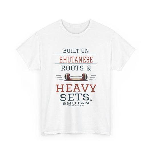 White Bhutan Heavy Sets Gym T-Shirt front, reading “Built on Bhutanese roots & heavy sets.” with Bhutan and Roots & Roads signature