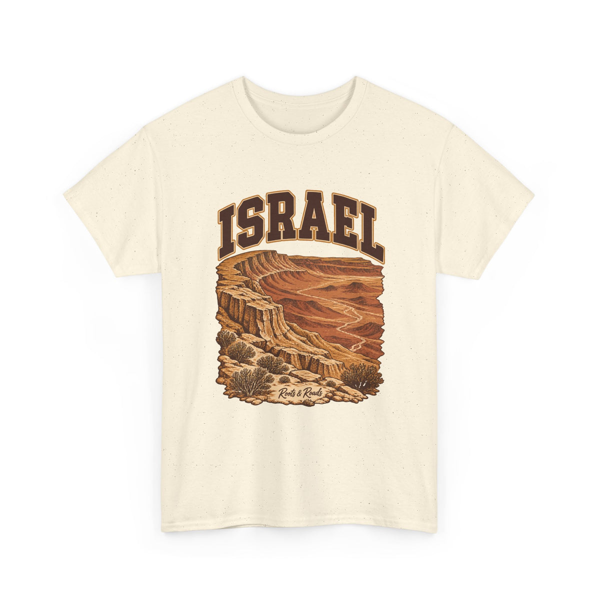 Front view of a Natural Gildan 5000 T-shirt with dark-brown ISRAEL lettering, layered ochre cliffs, dry channels and desert shrubs, and Roots & Roads script.