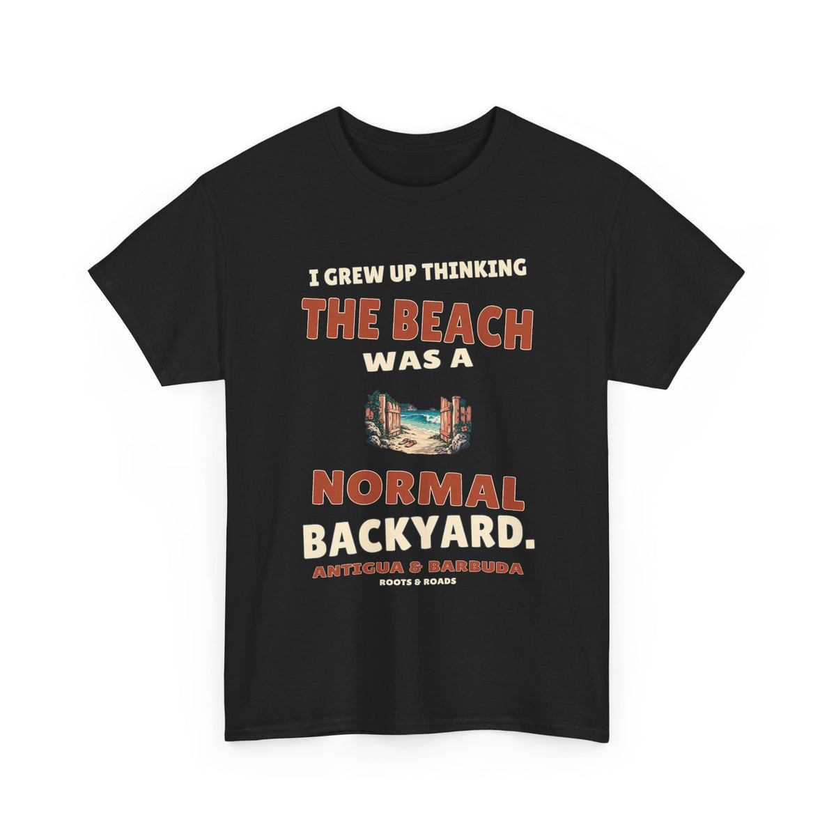 Black Antigua & Barbuda T-shirt, front view with vintage artwork reading “I grew up thinking the beach was a normal backyard.” and Roots & Roads signature.