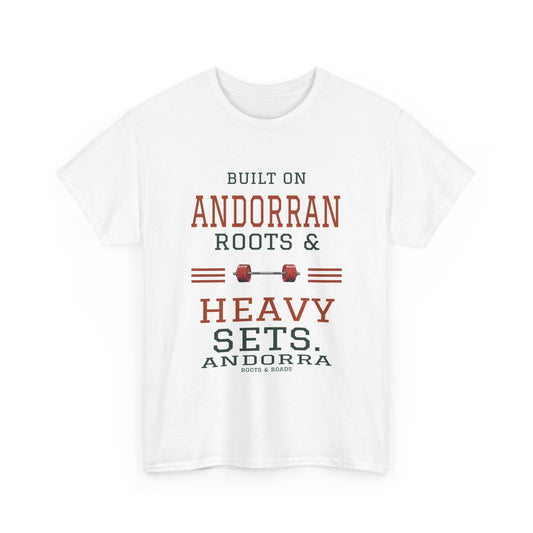 Front view of the White Andorra Heavy Sets Gym T-Shirt with varsity lettering reading “Built on Andorran roots & heavy sets.”, a barbell, Andorra label and Roots & Roads signature.
