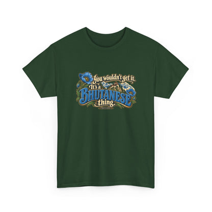 Forest Green Bhutan Bhutanese Thing T-shirt, shaped front view with blue vintage lettering, cream script, blue poppies and a Himalayan monastery; “You wouldn’t get it. It’s a Bhutanese thing.”