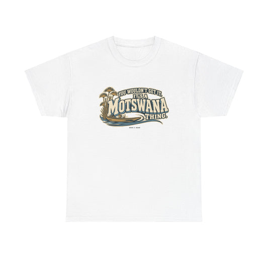 Front view of the White Motswana Thing T-shirt with “You wouldn’t get it. It’s a Motswana thing.” ivory athletic lettering with blue shadows, an integrated mokoro canoe, papyrus reeds and water lines.