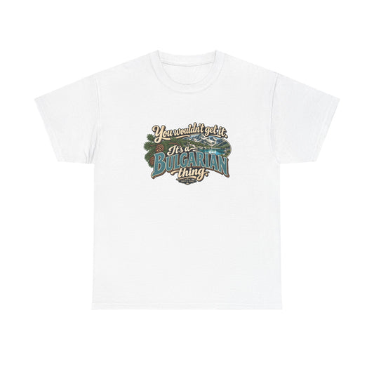 Bulgaria Bulgarian Thing T-shirt in White, flat front view with teal Bulgarian lettering, cream script, pine branches and a mountain lake. Roots & Roads.