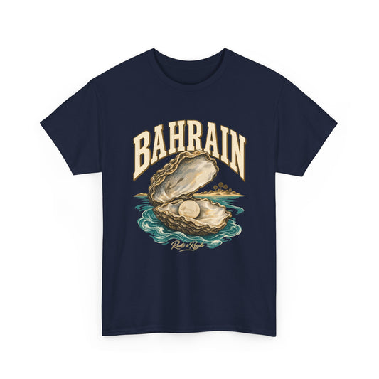 Front view of a Navy Gildan 5000 T-shirt with cream BAHRAIN lettering, an open oyster shell with a pearl, turquoise water, a palm-lined shore and Roots & Roads script.