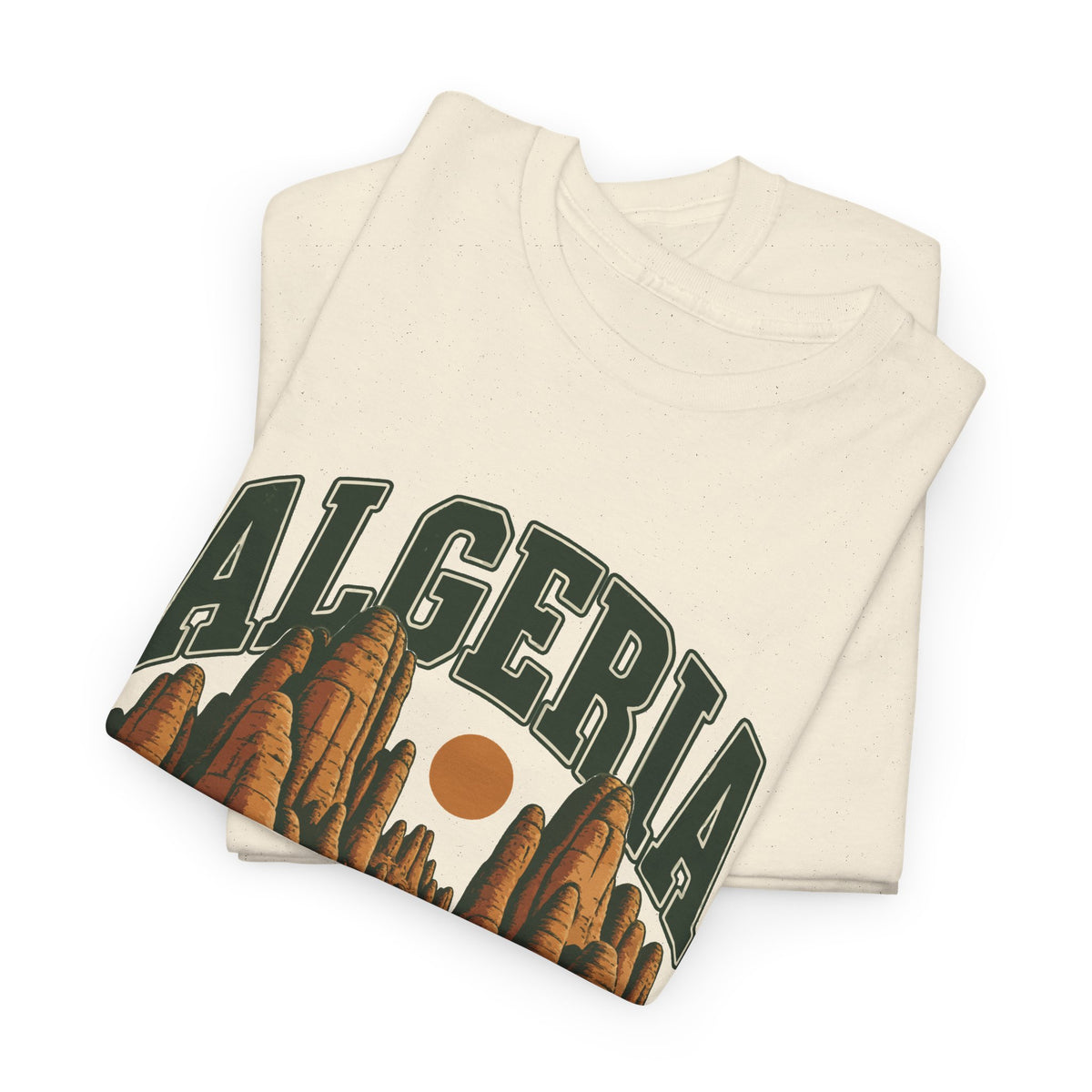 Folded Natural Gildan 5000 Algeria Fresh Prints T-shirt showing the green collegiate country lettering and warm ochre desert artwork.