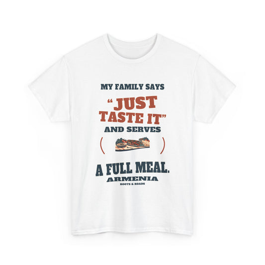 Armenia Just Taste It T-Shirt in White, with the full quote “My family says “just taste it” and serves a full meal.”, Armenia label, and Roots & Roads signature on the front.