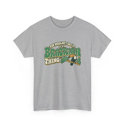 Alternate front view of the Sport Grey Brazilian Thing T-shirt with “You wouldn’t get it. It’s a Brazilian thing.” green bubble lettering with ivory outlines, ochre shadows and an integrated toucan on a leafy branch.