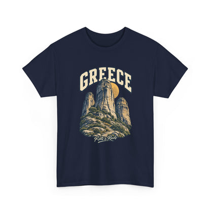 Front view of a Navy Gildan 5000 T-shirt with cream GREECE lettering above rounded sandstone towers, ochre disc, rocky foreground, low shrubs, finished with Roots & Roads script.