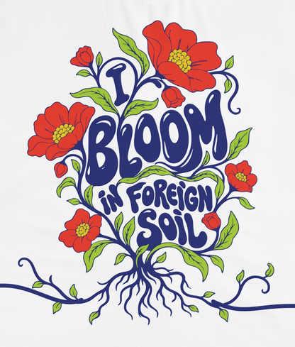 Close-up of the botanical artwork on the I bloom in foreign soil T-shirt
