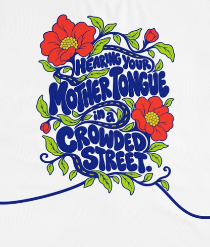 Actual supplier front-view detail of the wearer’s right sleeve on the Roots & Roads “Hearing your mother tongue in a crowded street.” T-shirt.