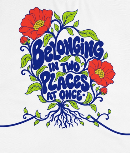 Actual supplier mockup detail of the Roots & Roads “Belonging in two places at once·” T-shirt’s botanical artwork.