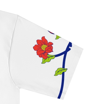 Actual supplier mockup detail of the Roots & Roads “Love speaks every language” T-shirt’s botanical artwork.