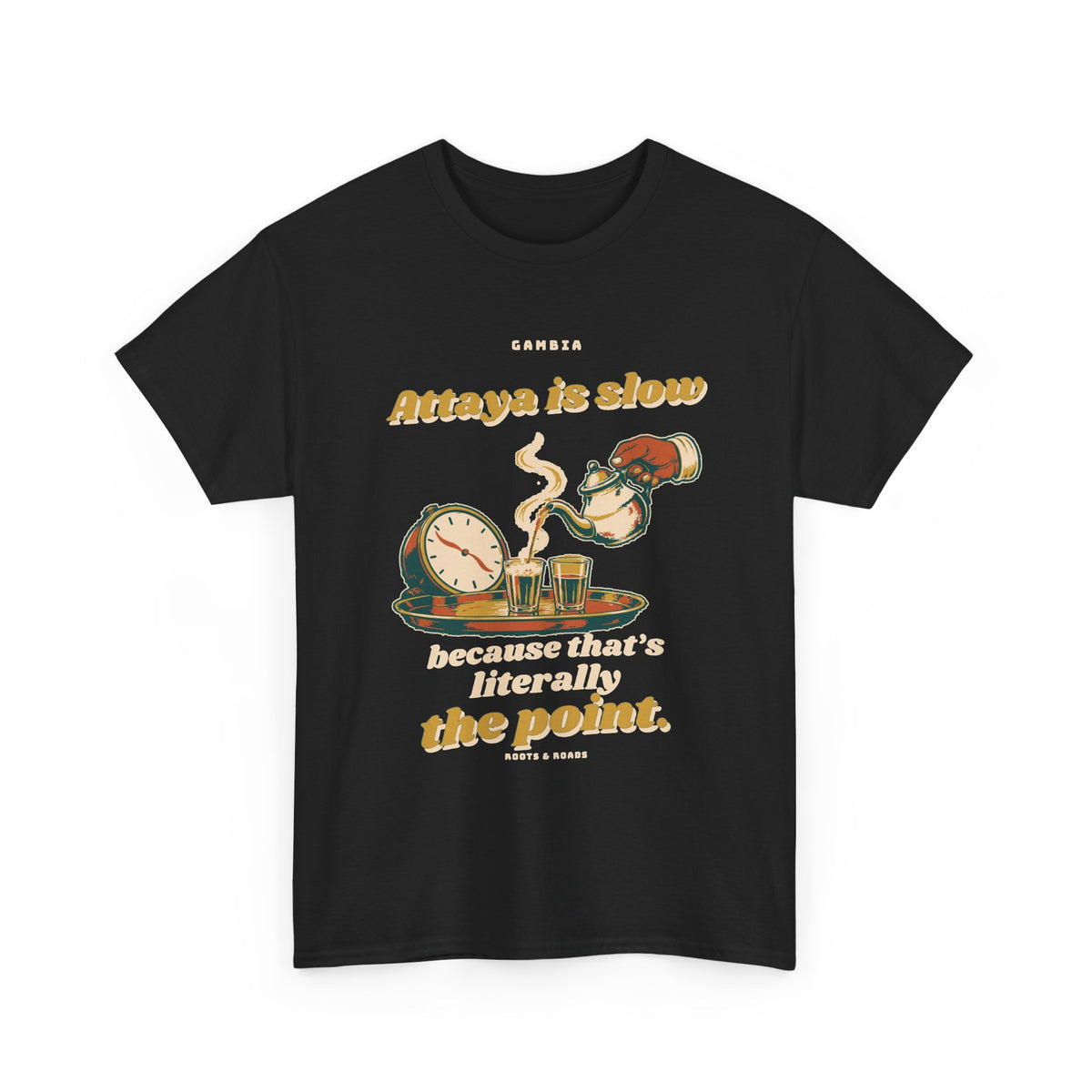 Gambia Attaya Takes Its Time T-Shirt in Black — expressive retro lettering with a teapot pouring into small glasses beside a relaxed clock on the front.