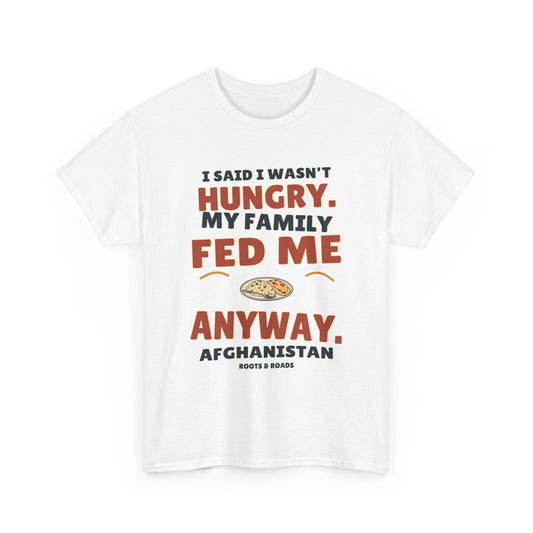 White Afghanistan T-shirt, front view, with oversized retro lettering reading “I said I wasn’t hungry. My family fed me anyway.” and a rice-and-bread plate illustration.