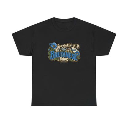 Black Bhutan Bhutanese Thing T-shirt, flat front view with blue vintage lettering, cream script, blue poppies and a Himalayan monastery; “You wouldn’t get it. It’s a Bhutanese thing.”