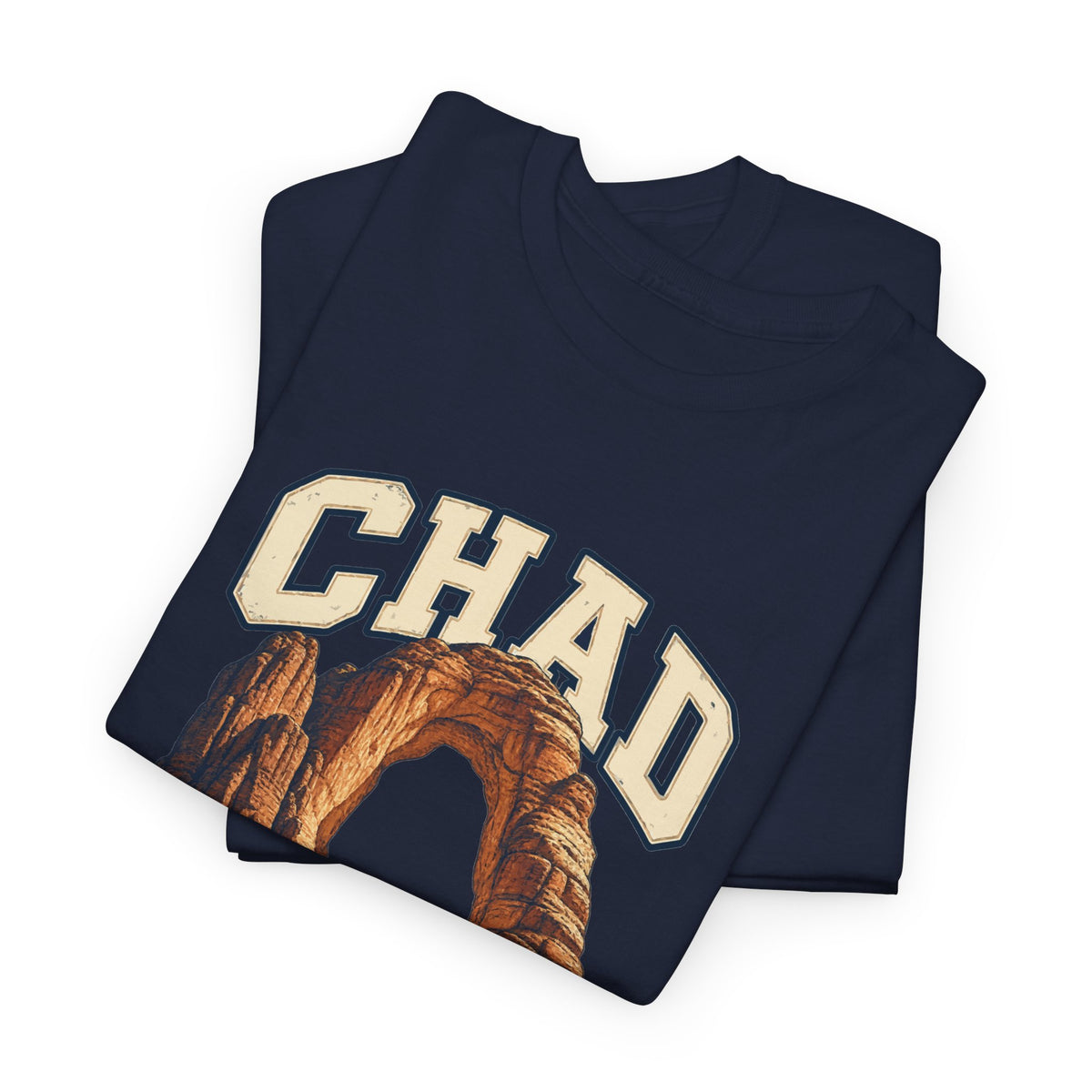 Folded Navy Chad Fresh Prints T-shirt showing cream CHAD lettering above an ochre sandstone arch.