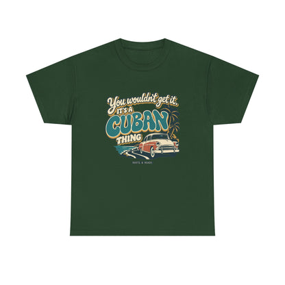 Front view of the Forest Green Cuban Thing T-shirt with “You wouldn’t get it. It’s a Cuban thing.” oversized teal rounded lettering with cream outlines and ochre shadows, a vintage coral car, coastal road and palm trees.