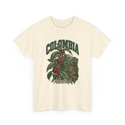 Front view of a Natural Gildan 5000 T-shirt with green COLOMBIA lettering above a coffee branch with red cherries and cultivated hills, finished with Roots & Roads script.