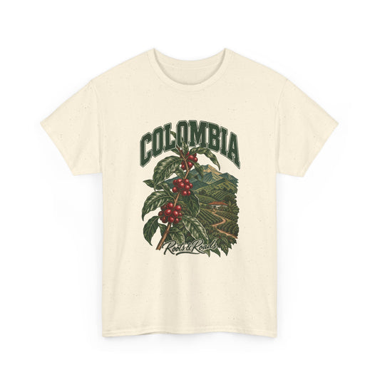 Front view of a Natural Gildan 5000 T-shirt with green COLOMBIA lettering above a coffee branch with red cherries and cultivated hills, finished with Roots & Roads script.