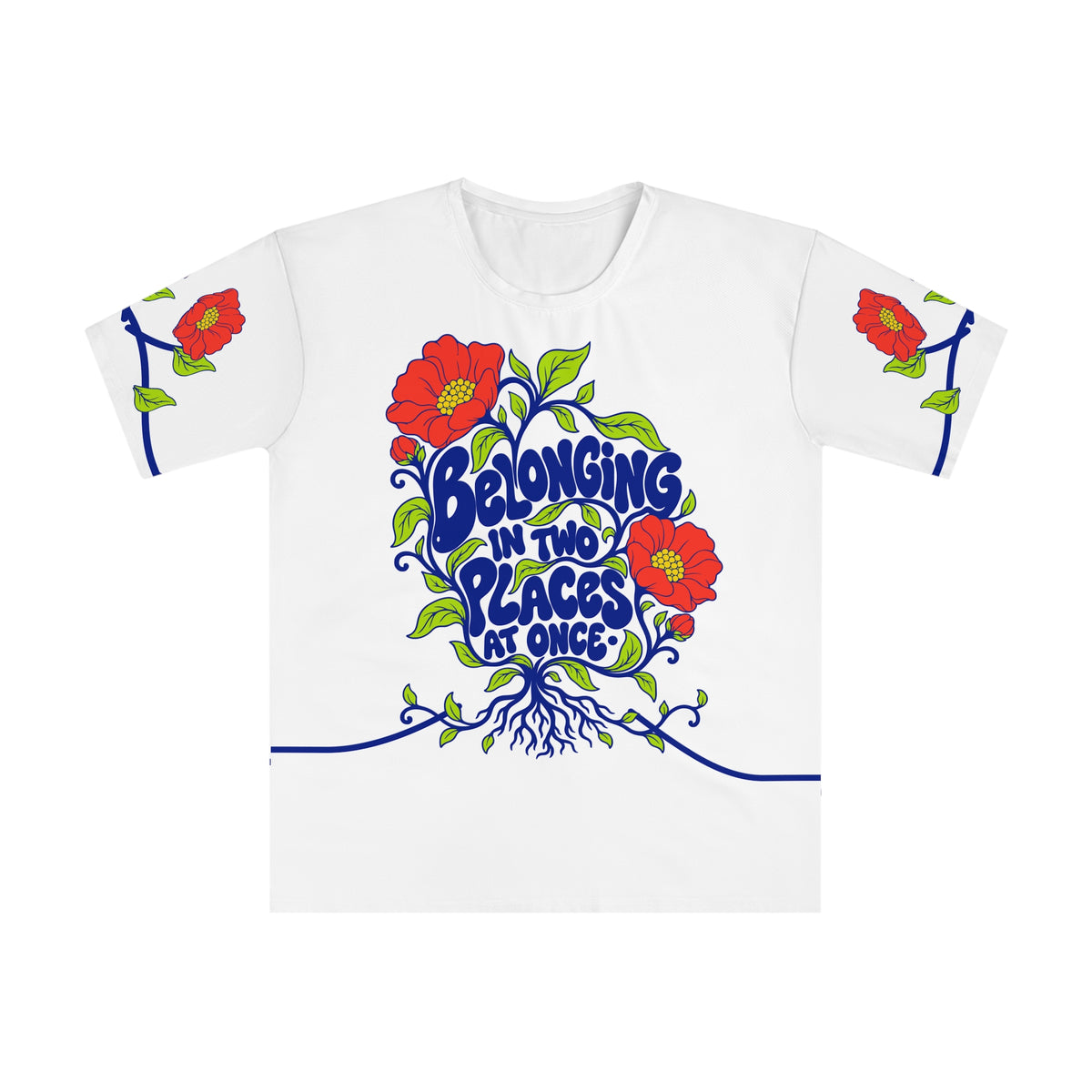 Front of the Roots & Roads “Belonging in two places at once·” T-shirt with cobalt bubble lettering, coral flowers, lime leaves and curling roots on white.