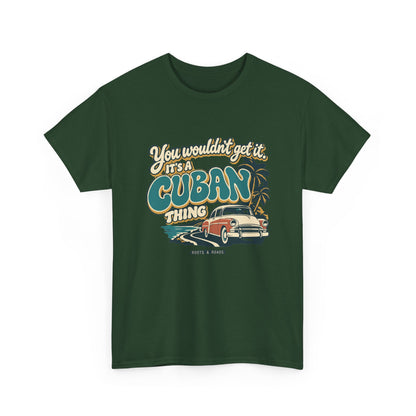 Alternate front view of the Forest Green Cuban Thing T-shirt with “You wouldn’t get it. It’s a Cuban thing.” oversized teal rounded lettering with cream outlines and ochre shadows, a vintage coral car, coastal road and palm trees.