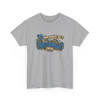 Sport Grey Bhutan Bhutanese Thing T-shirt, shaped front view with blue vintage lettering, cream script, blue poppies and a Himalayan monastery; “You wouldn’t get it. It’s a Bhutanese thing.”