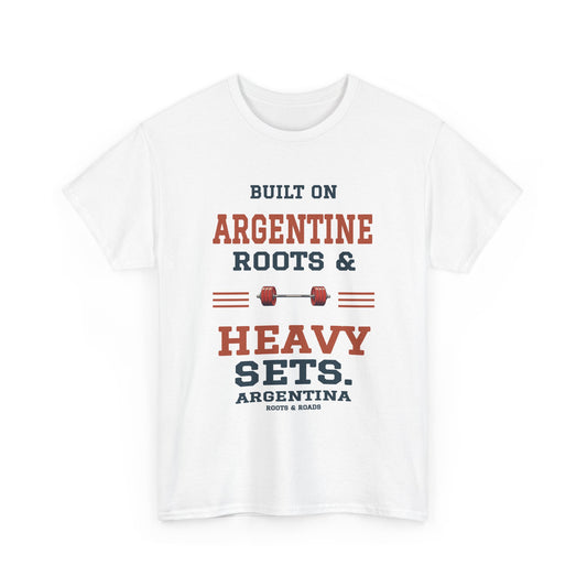 Argentina Heavy Sets Gym T-Shirt in White, with the full quote “Built on Argentine roots & heavy sets.”, Argentina label, and Roots & Roads signature on the front.