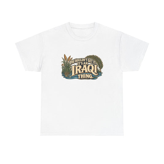 White Iraq Iraqi Thing T-shirt, flat front view with oversized cream lettering, marsh reeds, palm fronds and flowing blue water; “You wouldn’t get it. It’s an Iraqi thing.”