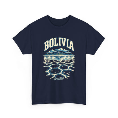 Front view of a Navy Gildan 5000 T-shirt with cream BOLIVIA lettering above blue highland peaks, reflected clouds and polygonal salt-flat patterns, with Roots & Roads script.