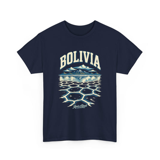 Front view of a Navy Gildan 5000 T-shirt with cream BOLIVIA lettering above blue highland peaks, reflected clouds and polygonal salt-flat patterns, with Roots & Roads script.