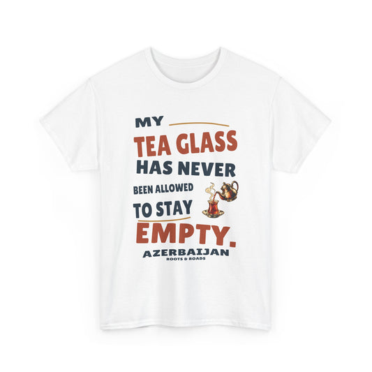 Azerbaijan Never Empty Tea Glass T-Shirt in White, with the full quote “My tea glass has never been allowed to stay empty.”, Azerbaijan label, and Roots & Roads signature on the front.